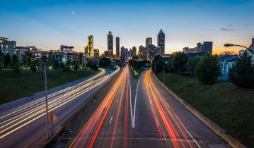 Two large roads with orange and red lights